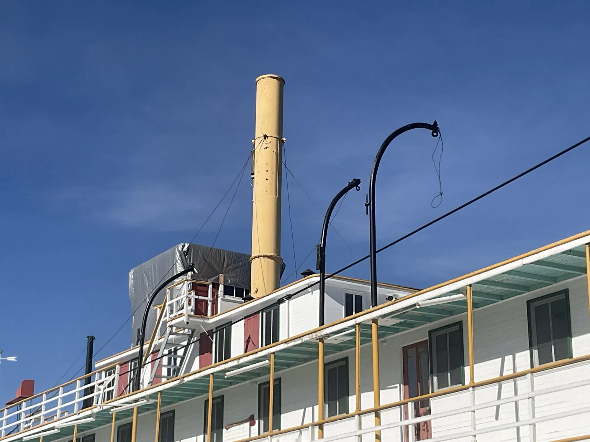 Buff stack, curved davits and texas deck seen from below