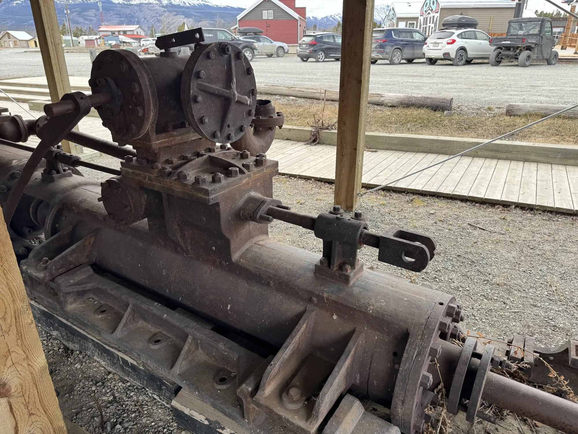 Starboard engine valve chest atop the cylinder, with a parking lot in the background