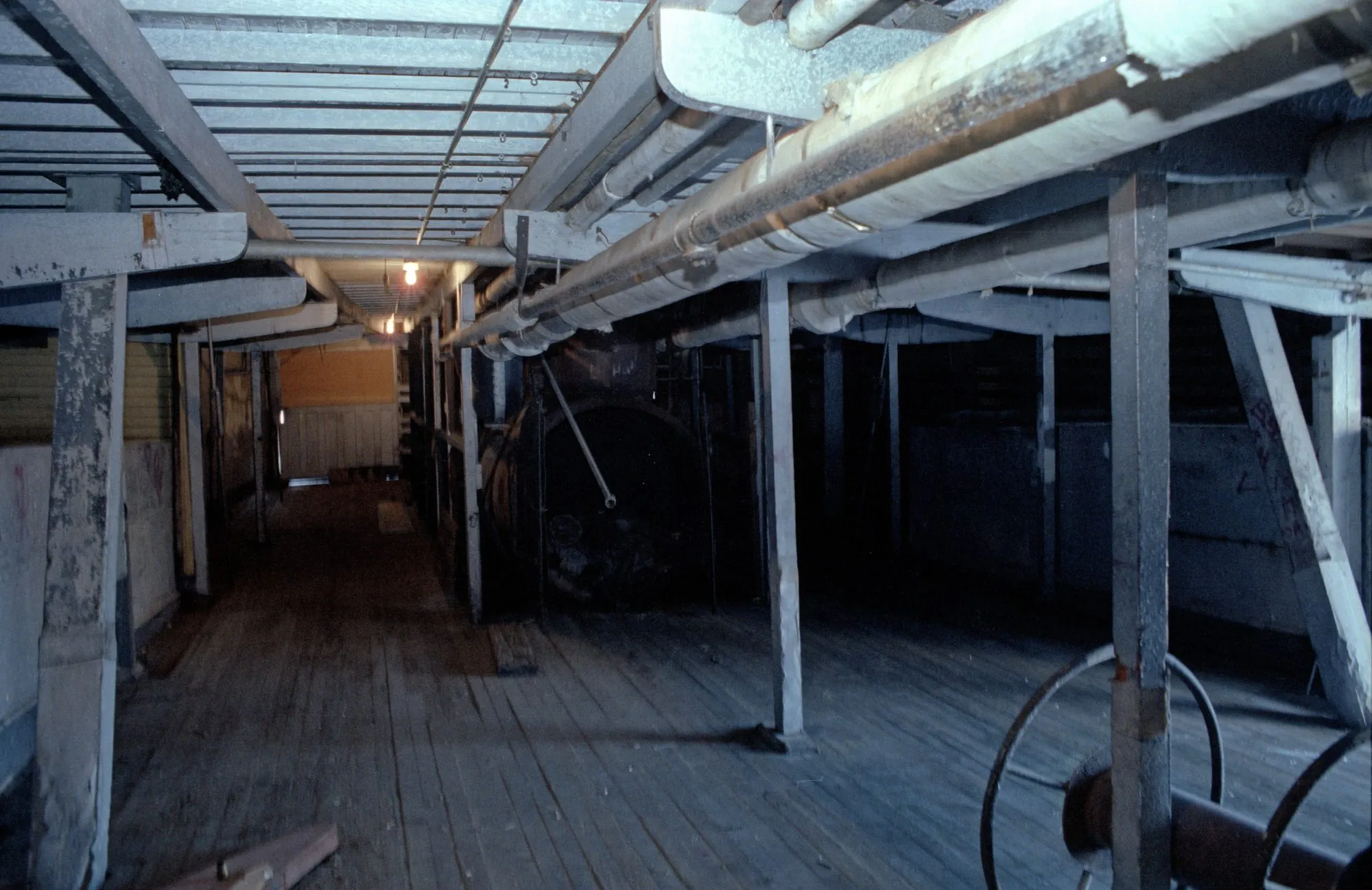 Freight deck interior with overhead piping