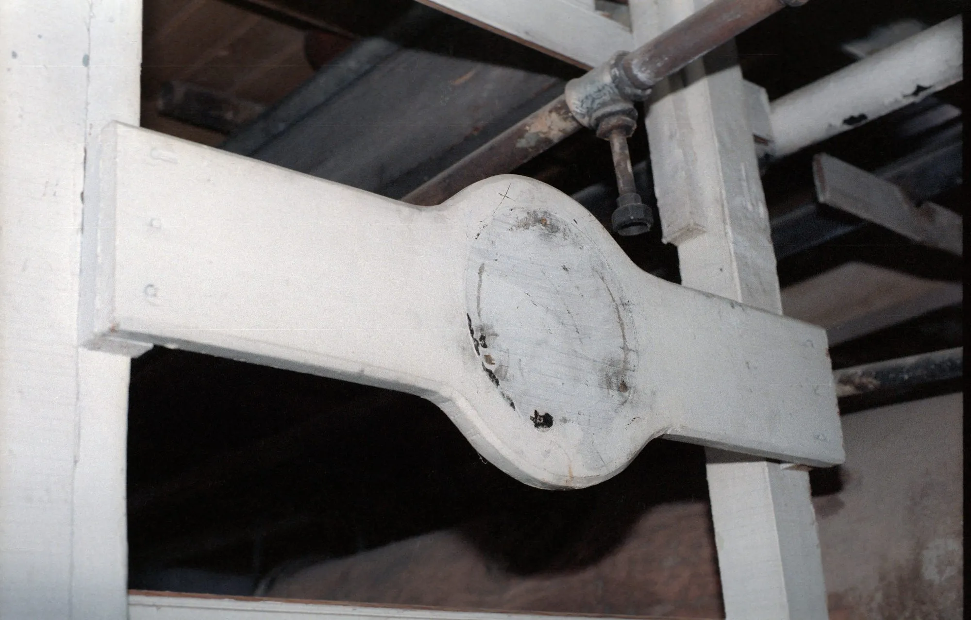 Post with a circular collar through a beam